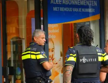 Overval op telefoonwinkel daders dreigen met vuurwapen