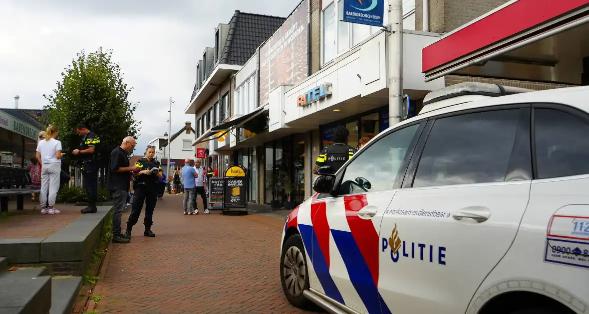 Overval op telefoonwinkel daders dreigen met vuurwapen - Foto 1