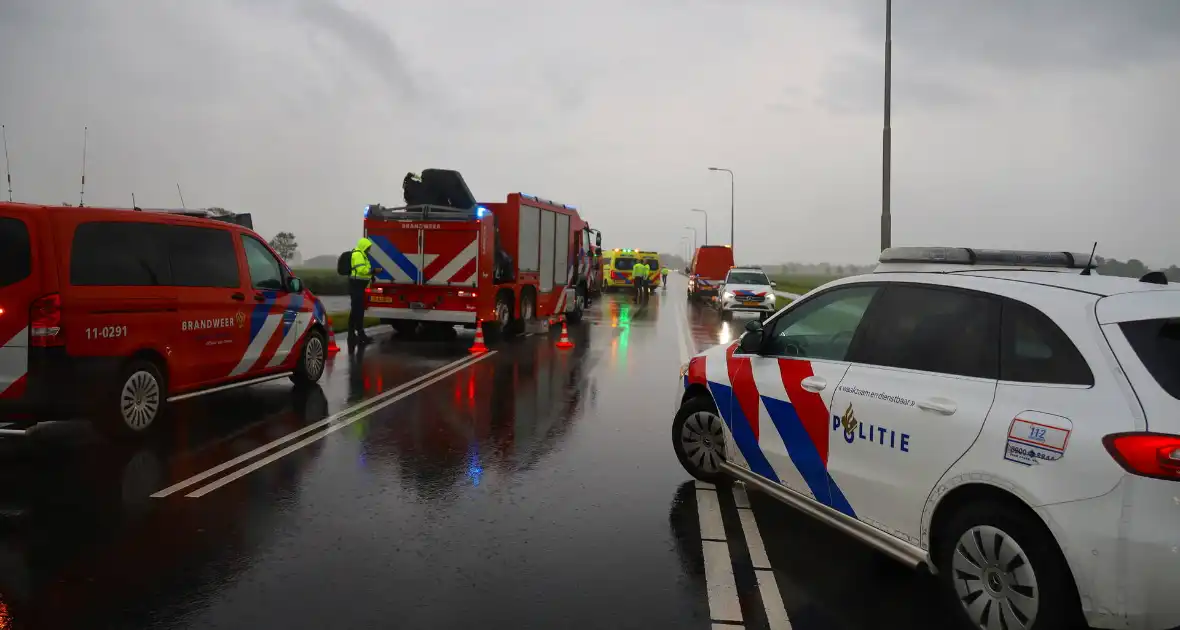 Omstanders verrichten heldendaad en redden te water geraakte automobilist - Foto 2