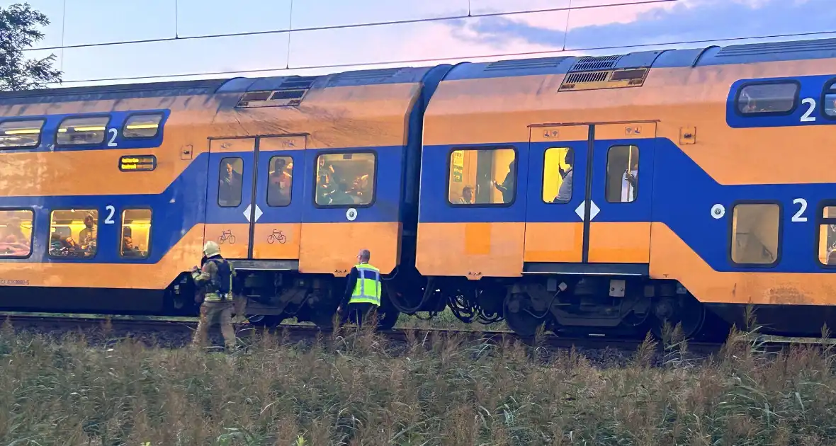 Rookontwikkeling onder trein door vastgelopen remmen - Foto 1