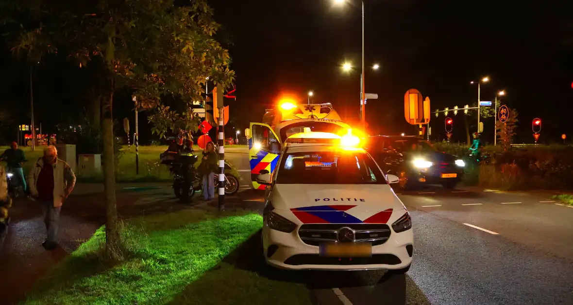 Motorrijder en fietser in botsing bij verkeerslicht - Foto 6