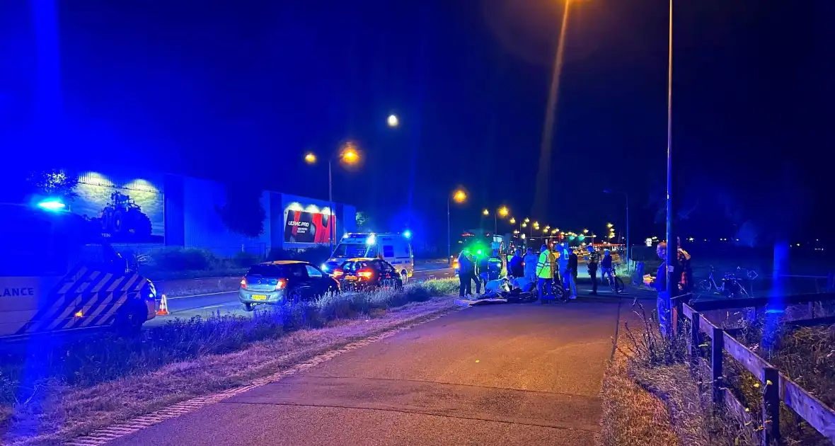 Fietser botst op auto - Foto 2