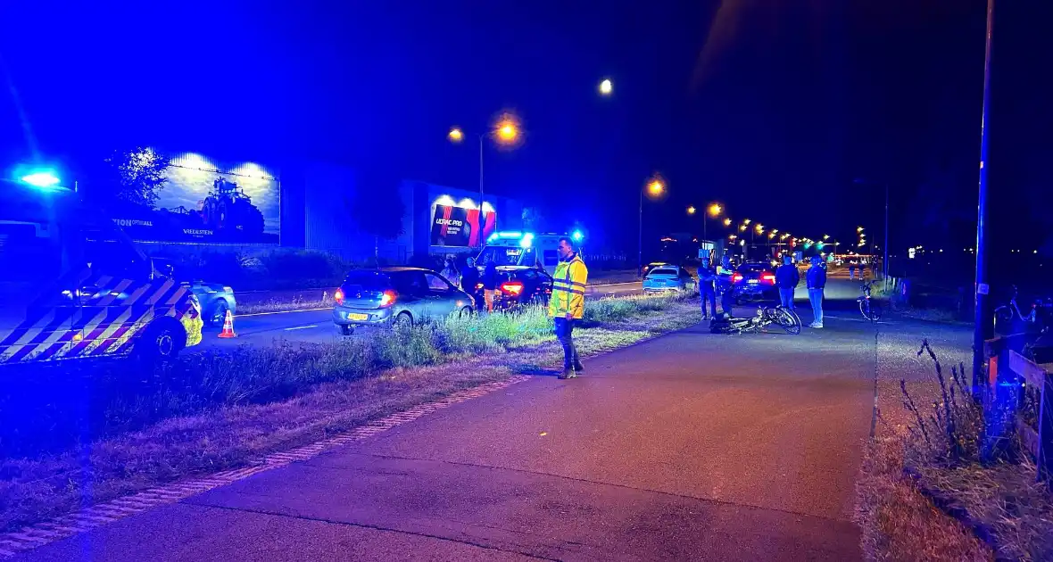 Fietser botst op auto - Foto 6