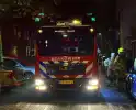 Brandweer blus brand in container