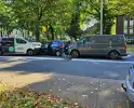 Drie voertuigen en fietser met elkaar in botsing