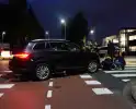 Scooterrijder klapt op personenauto