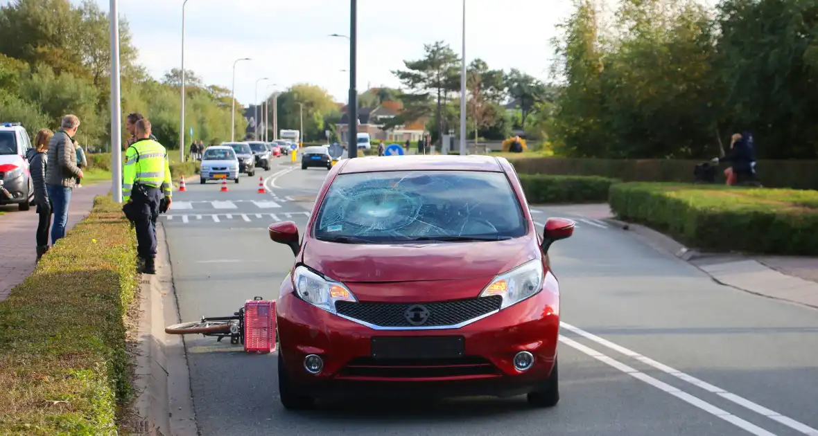 Kind op fiets geschept door automobilist - Foto 7