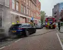 Scooter en auto beschadigd door brand