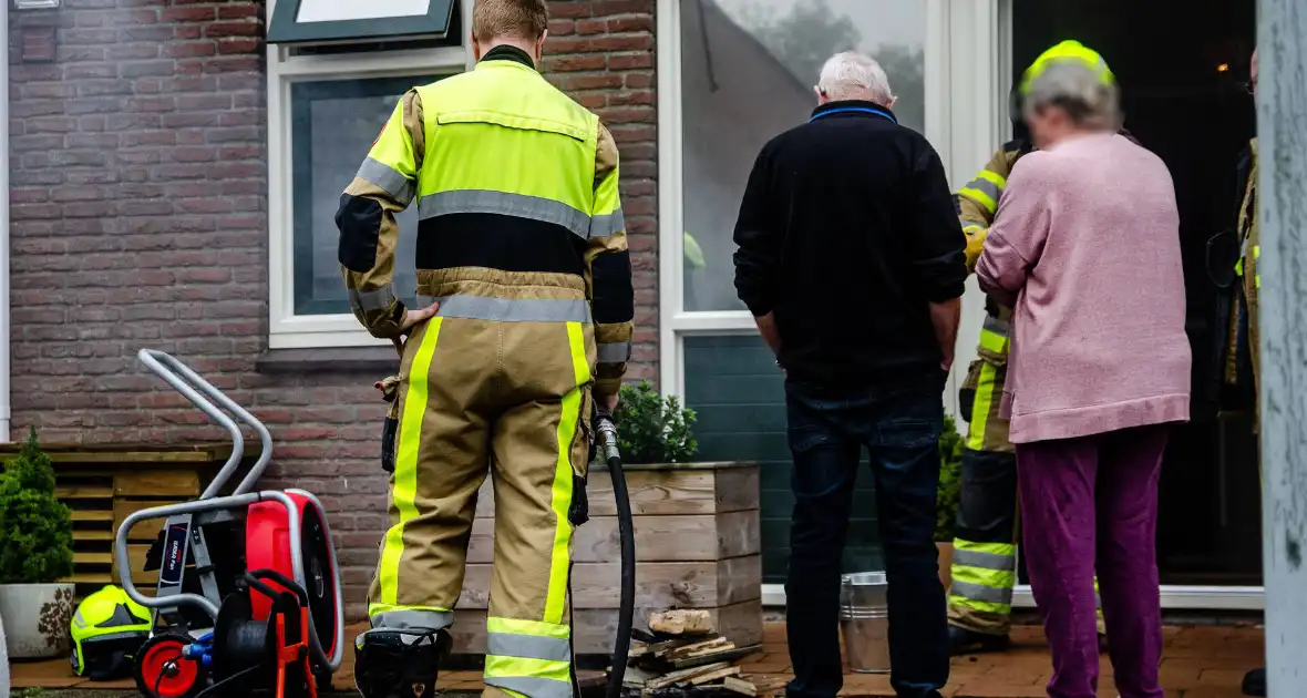 Houtkachel veroorzaakt rookontwikkeling in woning - Foto 1