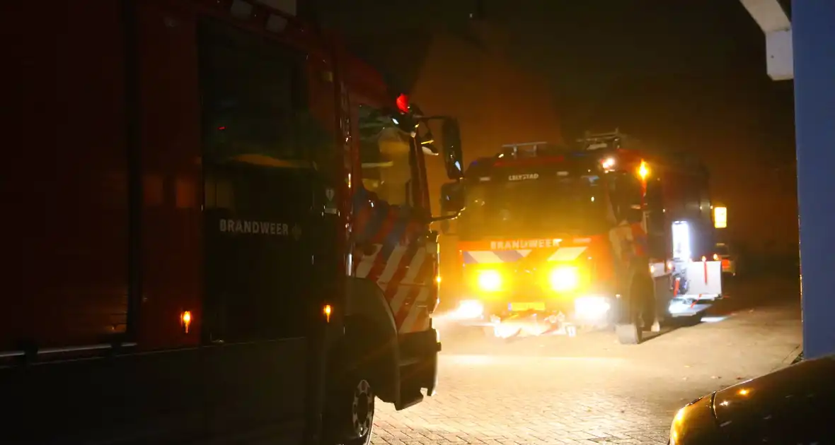 Woningen ontruimd door brand in parkeergarage - Foto 1