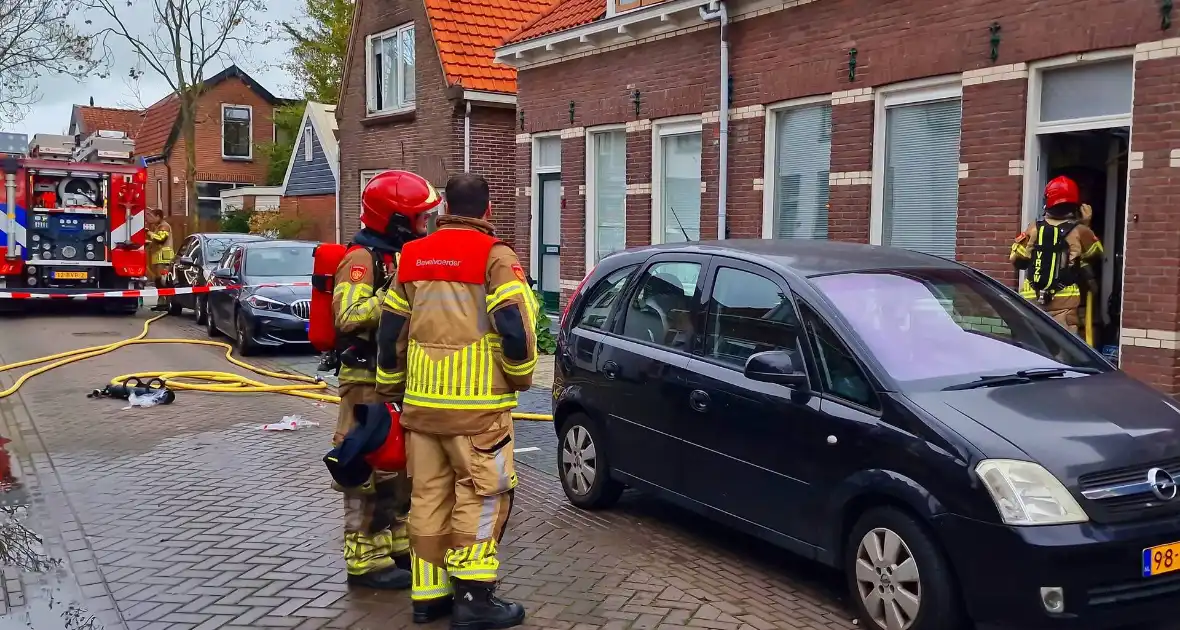 Bewoner probeert hulpdiensten te weren na brandmelding - Foto 3