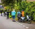 Bezorgscooter en fietser botsen op kruising