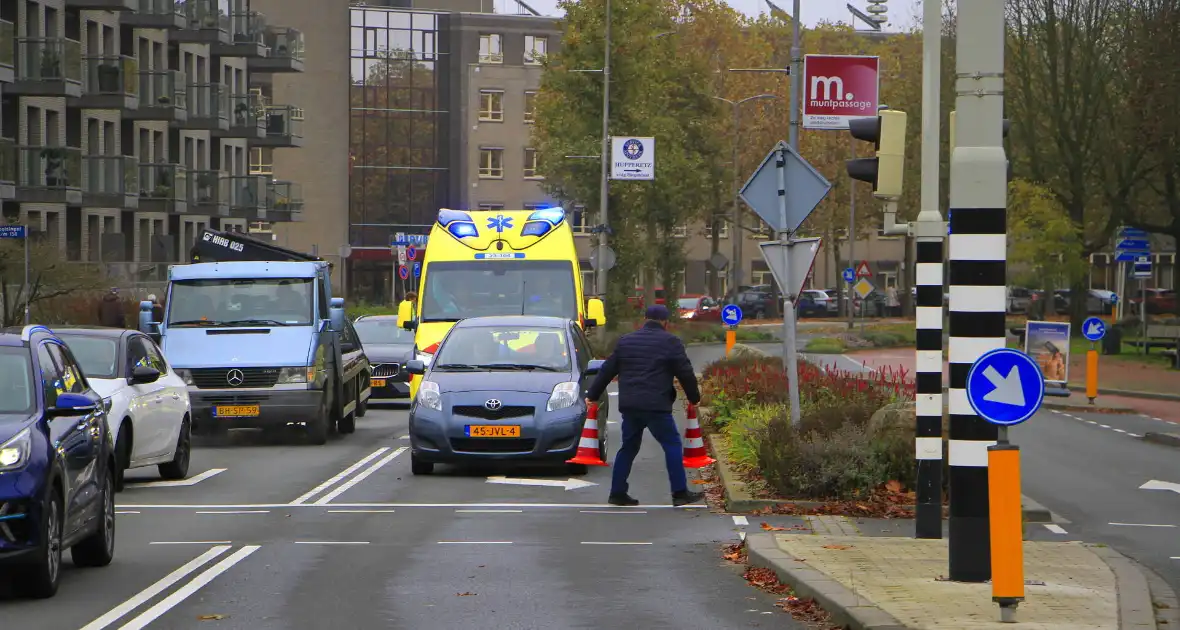 Scholier geschept door automobilist bij verkeerslicht - Foto 3