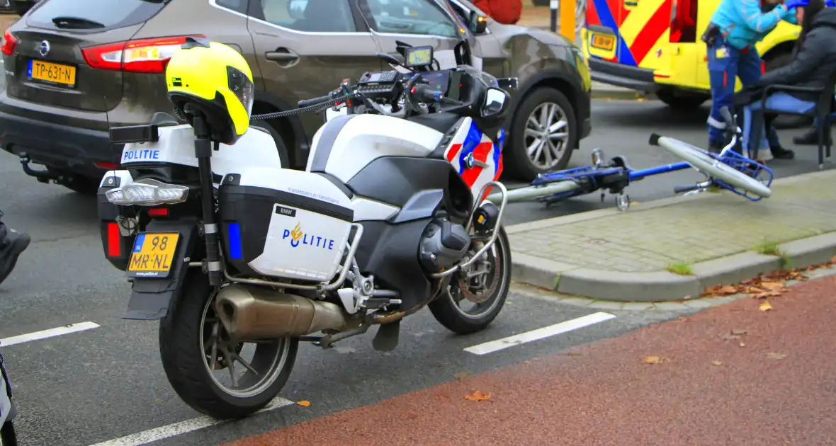 Scholier geschept door automobilist bij verkeerslicht - Foto 4