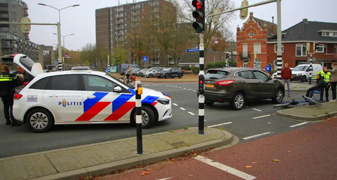 Scholier geschept door automobilist bij verkeerslicht - Foto 9