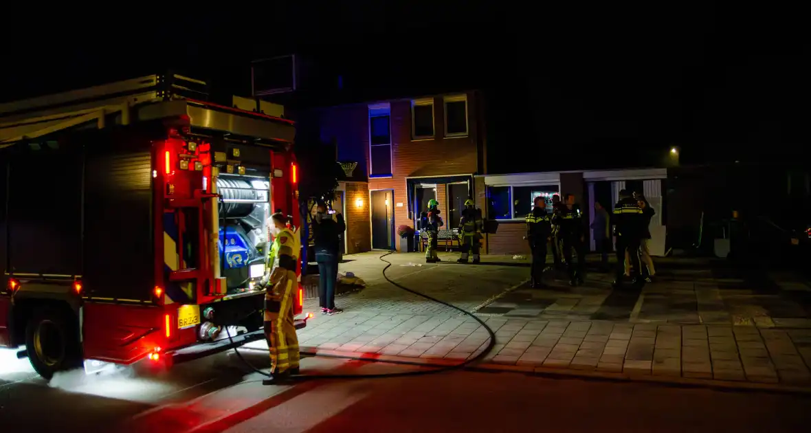 Brandweer blust brandende wasmachine - Foto 1