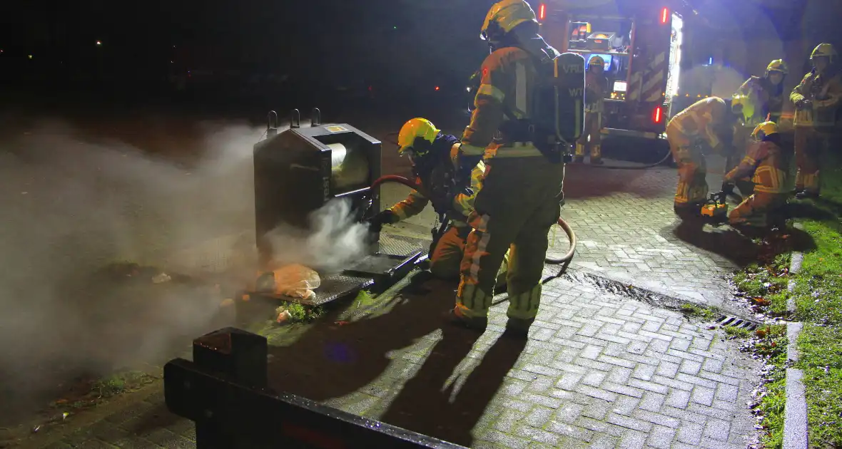 Brand in ondergrondse container gedoofd - Foto 10