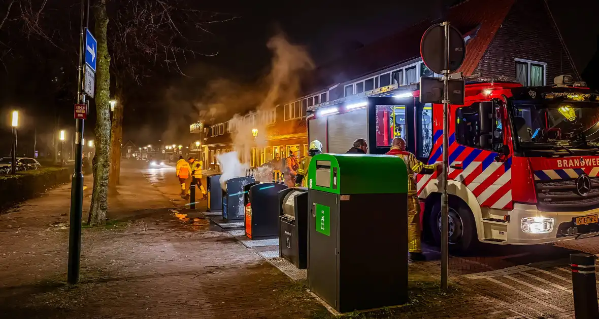 Brandweer laat ondergrondse container vollopen - Foto 1