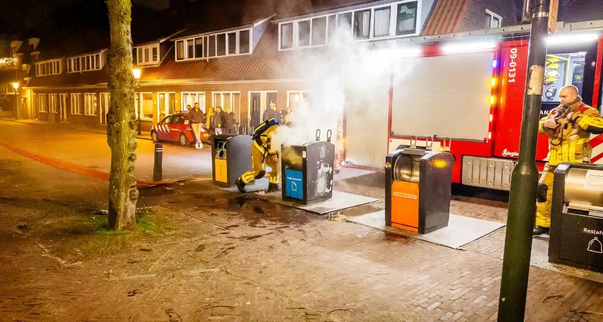 Brandweer laat ondergrondse container vollopen - Foto 4