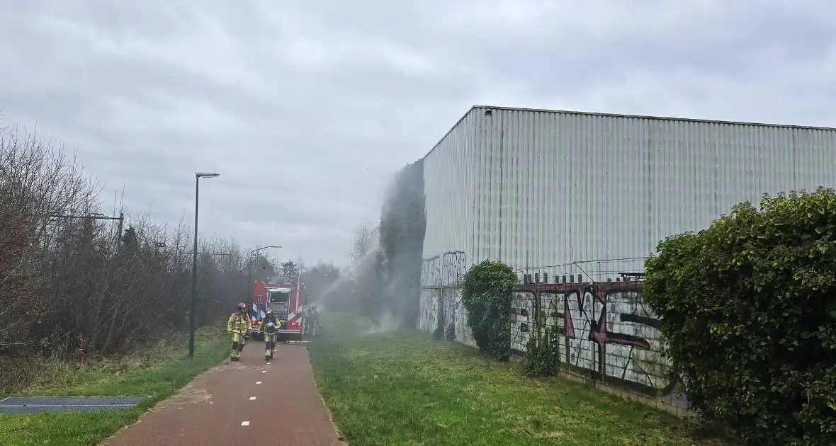 Begroeiing tegen pand in brand - Foto 1