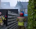 Buren grijpen in bij brand in prullenbak