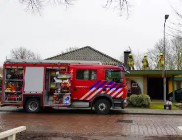 Brand in schoorsteen van fotowinkel