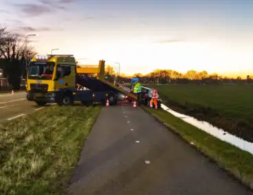 Auto te water na botsing