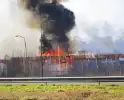 Veel rookontwikkeling zichtbaar bij uitslaande brand