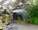 Schade aan poort en schutting door brand