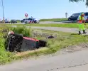 Invalidenauto raakt te water na ongeval