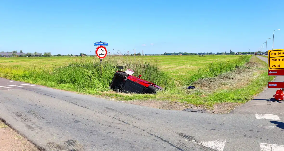 Invalidenauto raakt te water na ongeval - Foto 4