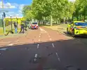 Verkeersongeluk tussen fietser en scooterrijder