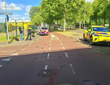 Verkeersongeluk tussen fietser en scooterrijder