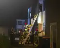 Gezin uit brandende woning gered via ladder
