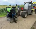 Scootmobiel belandt in sloot, bestuurder gewond