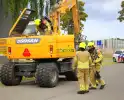Grijpmachine vat vlam in loods