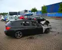 BMW in brand op parkeerplaats