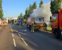 Vuilniswagen vat vlam