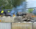 Brand in landbouwvoertuig op bouwterrein