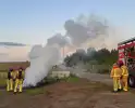Scooter en pallet verwoest door brand