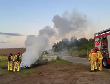Scooter en pallet verwoest door brand