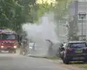 Brand in elektrische auto bij woning