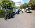 Scooter botst op achteruitrijdende auto