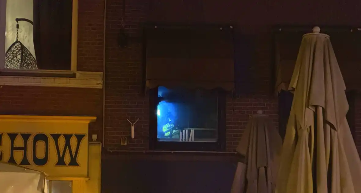 Brand in prullenbak in een cafe - Foto 5