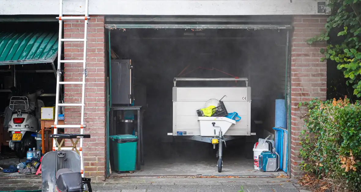Veel brandschade aan garagebox - Foto 7