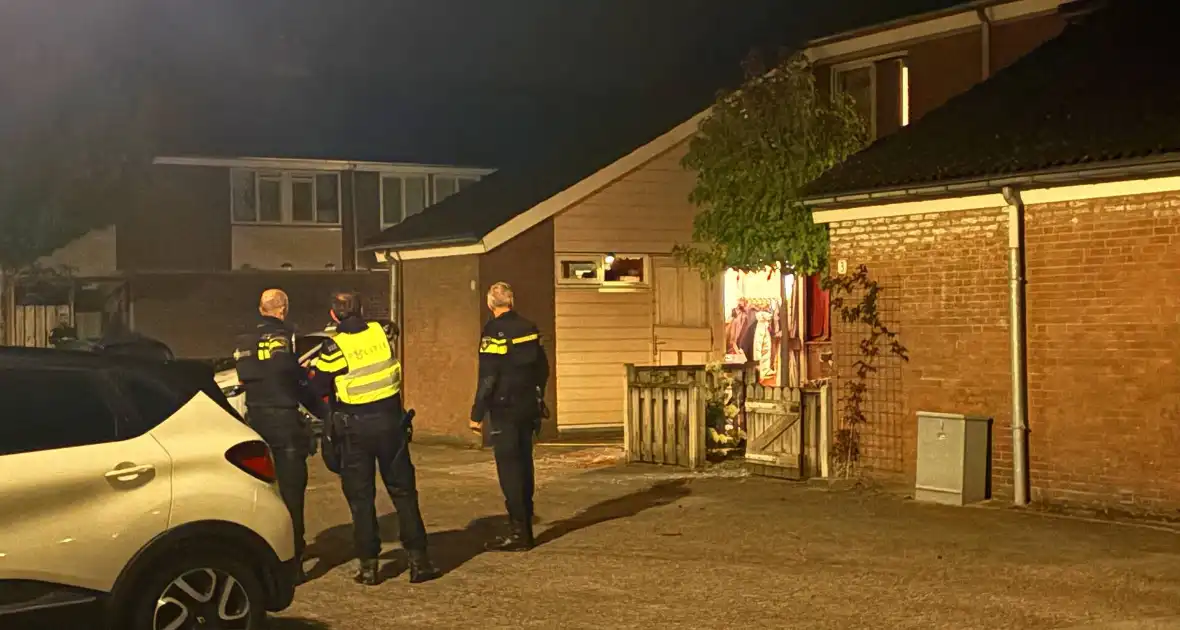 Voordeur vernield bij woningbrand