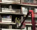Explosie in flatwoning, grote brandweerinzet