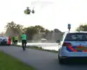 Fietser te water in ernstige situatie