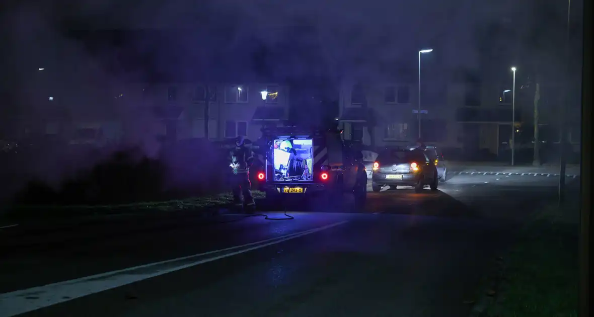 Brand in kledingcontainer veroorzaakt rookwolken - Foto 9