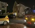 Brandweer controleert kachelpijp in achtertuin